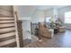 Cozy seating area with comfortable armchairs, soft lighting, and elegant decor at 2247 Pink Hawthorn Dr, Buford, GA 30518