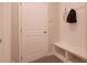Mudroom has a bench with storage and wall hooks at 2247 Pink Hawthorn Dr, Buford, GA 30518