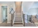 View of staircase with wood banister, white risers, and wood treads, leading to the upper level at 2247 Pink Hawthorn Dr, Buford, GA 30518