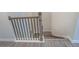 Detailed view of a staircase featuring hardwood steps and decorative black wrought iron spindles at 2247 Pink Hawthorn Dr, Buford, GA 30518