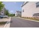 Street view of townhomes with trees and landscaped grounds at 2247 Pink Hawthorn Dr, Buford, GA 30518