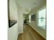 Bright hallway featuring hardwood floors and windows with natural light at 304 Marigold Ln, Woodstock, GA 30188