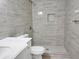 Contemporary bathroom with tiled walk-in shower, toilet, and vanity with single sink at 3725 Crescent Walk Ln, Suwanee, GA 30024