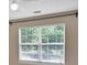 Bedroom view featuring large window with blinds at 3725 Crescent Walk Ln, Suwanee, GA 30024