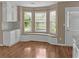 Cozy breakfast nook features a bay window seat and natural light, perfect for enjoying your morning coffee at 3725 Crescent Walk Ln, Suwanee, GA 30024
