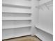 Walk-in closet features built-in shelving for ample storage at 3725 Crescent Walk Ln, Suwanee, GA 30024