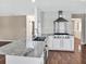 Bright kitchen with stainless steel appliances, granite countertops, and a sleek island with sink at 3725 Crescent Walk Ln, Suwanee, GA 30024