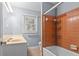 Cozy bathroom with a separate shower tub, ample lighting, and a neutral color palette at 3957 Evans Drive Dr, Lithia Springs, GA 30122