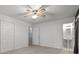 Spacious bedroom featuring neutral carpet, ceiling fan, and access to an ensuite bathroom at 3957 Evans Drive Dr, Lithia Springs, GA 30122