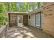 Cozy outdoor deck featuring screen walls, a traditional wood finish, and access to the house at 3957 Evans Drive Dr, Lithia Springs, GA 30122