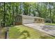 A suburban house with attached garage and long driveway surrounded by lush green trees at 3957 Evans Drive Dr, Lithia Springs, GA 30122