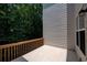 Tiled balcony with wood railing offers an ideal outdoor retreat with wooded view at 1622 Rivergreen Se Bnd # 26, Atlanta, GA 30339