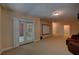 Spacious basement with projector screen, comfy seating, and a walkout to a brick patio at 1622 Rivergreen Se Bnd # 26, Atlanta, GA 30339
