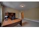 Bedroom featuring carpet floors, neutral walls, and a large wood desk with overhead compartments at 1622 Rivergreen Se Bnd # 26, Atlanta, GA 30339