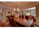 Open concept dining room with hardwood floors and elegant lighting fixtures at 1622 Rivergreen Se Bnd # 26, Atlanta, GA 30339