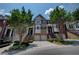 Charming townhome exterior featuring well-maintained landscaping and inviting entrances at 1622 Rivergreen Se Bnd # 26, Atlanta, GA 30339