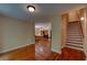 Second floor hallway features gleaming wood floors and provides access to the stairway and bedroom at 1622 Rivergreen Se Bnd # 26, Atlanta, GA 30339