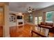 A bright living room with hardwood floors, fireplace and a comfortable leather sofa creates a warm ambiance at 1622 Rivergreen Se Bnd # 26, Atlanta, GA 30339