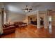 An inviting living room boasts hardwood floors, fireplace, comfortable furniture and seamless transition to the dining room at 1622 Rivergreen Se Bnd # 26, Atlanta, GA 30339