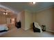 Spacious main bedroom featuring neutral walls, carpet floors, and a tray ceiling with a ceiling fan at 1622 Rivergreen Se Bnd # 26, Atlanta, GA 30339