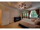 A sprawling main bedroom with natural light, plush carpet and a ceiling fan provide comfort and style at 1622 Rivergreen Se Bnd # 26, Atlanta, GA 30339