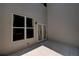 Private patio with neutral tile, a window and glass panel door leading into the home at 1622 Rivergreen Se Bnd # 26, Atlanta, GA 30339