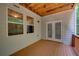 Charming porch featuring wood flooring, windows, and door to bring the outdoors in at 1622 Rivergreen Se Bnd # 26, Atlanta, GA 30339