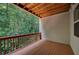 Inviting porch boasting wood flooring and railing, with a view of lush greenery at 1622 Rivergreen Se Bnd # 26, Atlanta, GA 30339