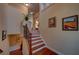 Elegant staircase with wood treads, iron railings, and neutral wall decor at 1622 Rivergreen Se Bnd # 26, Atlanta, GA 30339