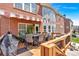Outdoor backyard deck with an outdoor dining area, grill, and seating under an awning with brick exterior at 3819 Courson St, Marietta, GA 30066