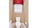 Cozy half bathroom featuring a toilet with bidet and a decorative window treatment at 3819 Courson St, Marietta, GA 30066