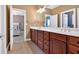 Bathroom boasts a double vanity with granite countertops and ample storage space at 3819 Courson St, Marietta, GA 30066