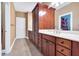Bathroom vanity with rich wood cabinetry, a double sink, and ample counter space at 3819 Courson St, Marietta, GA 30066