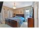 Comfortable bedroom features a large bed, wood furniture, neutral walls, and soft natural lighting at 3819 Courson St, Marietta, GA 30066