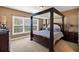 Comfortable bedroom featuring a four-poster bed and abundant natural light from the windows at 3819 Courson St, Marietta, GA 30066