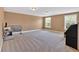 Large, open bonus room with neutral walls and carpet offers versatile space for recreation and relaxation at 3819 Courson St, Marietta, GA 30066