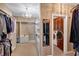 Spacious walk-in closet with custom shelving and a view into the laundry room at 3819 Courson St, Marietta, GA 30066