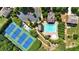 Aerial view showcases community pool and tennis courts surrounded by greenery, offering residents recreational amenities at 3819 Courson St, Marietta, GA 30066