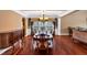 Elegant dining room with hardwood floors, chandelier, decorative molding, and large windows at 3819 Courson St, Marietta, GA 30066