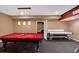 Finished basement game room with a pool table and air hockey table provides space for entertainment at 3819 Courson St, Marietta, GA 30066