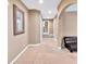 Inviting hallway featuring neutral walls, plush carpeting, an arched entrance, and elegant decorative touches at 3819 Courson St, Marietta, GA 30066
