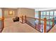 Hallway view with a wood railing and staircase that looks down to the living room at 3819 Courson St, Marietta, GA 30066