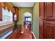 Gourmet kitchen with rich wood cabinetry, granite counters, and view to a formal dining room at 3819 Courson St, Marietta, GA 30066