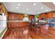 Gourmet kitchen with granite countertops, stainless steel appliances, and hardwood flooring at 3819 Courson St, Marietta, GA 30066