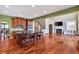 Open-concept kitchen with large island, hardwood floors, stainless appliances and view to living room at 3819 Courson St, Marietta, GA 30066