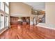 Expansive living area leading into a modern kitchen with island, hardwood floors, and stairs at 3819 Courson St, Marietta, GA 30066