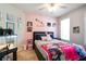 Cozy bedroom with fun pink wall, a comfortable bed, and unique decorations at 428 Redwood Trl, Canton, GA 30114