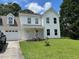 Beautiful two-story home boasts a well-manicured lawn, garage, and charming curb appeal at 433 Rhett Dr, Loganville, GA 30052