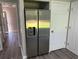 The image shows a refrigerator in a home kitchen with vinyl flooring at 433 Rhett Dr, Loganville, GA 30052