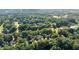 Residential neighborhood featuring lush tree coverage and peaceful pond within a golf course community at 1313 Fallsbrook Nw Ter, Acworth, GA 30101
